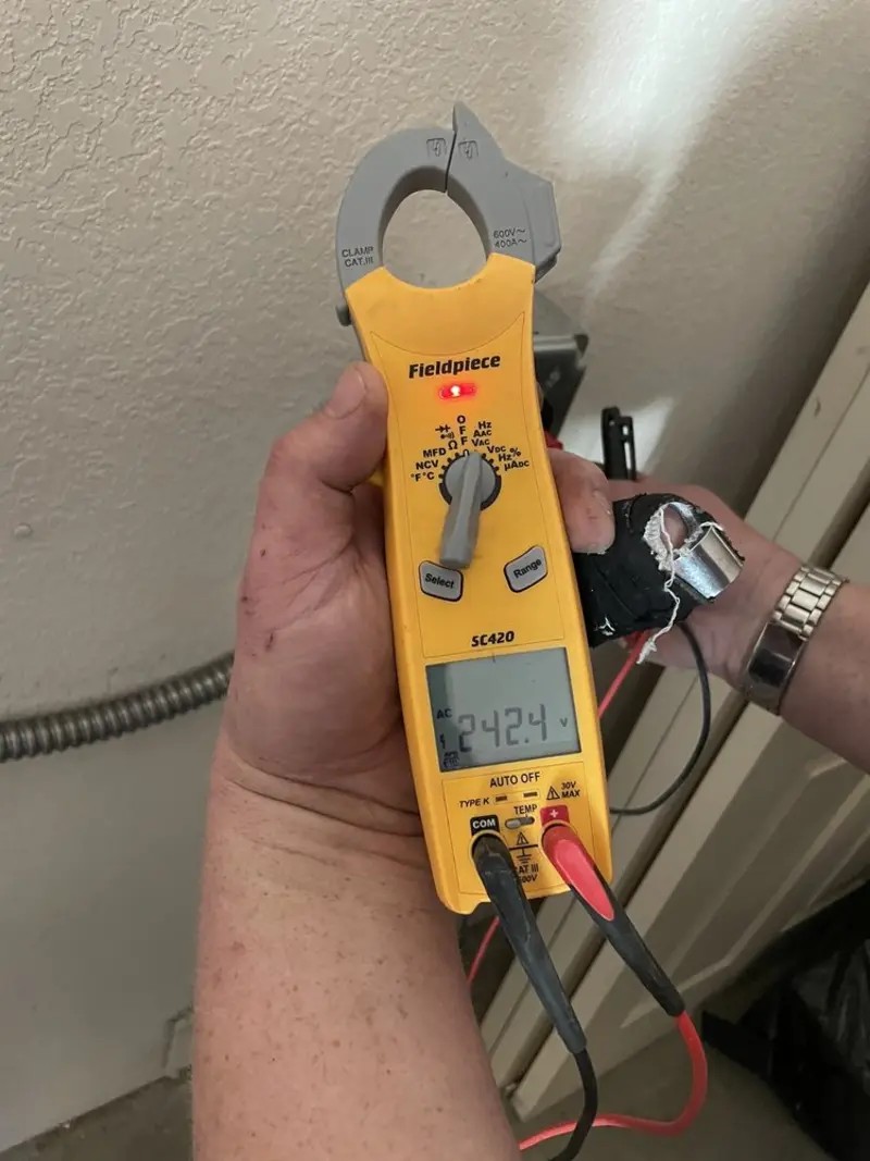 Voltage testing with clamp meter during Outlet Installation in Isle of Palms
